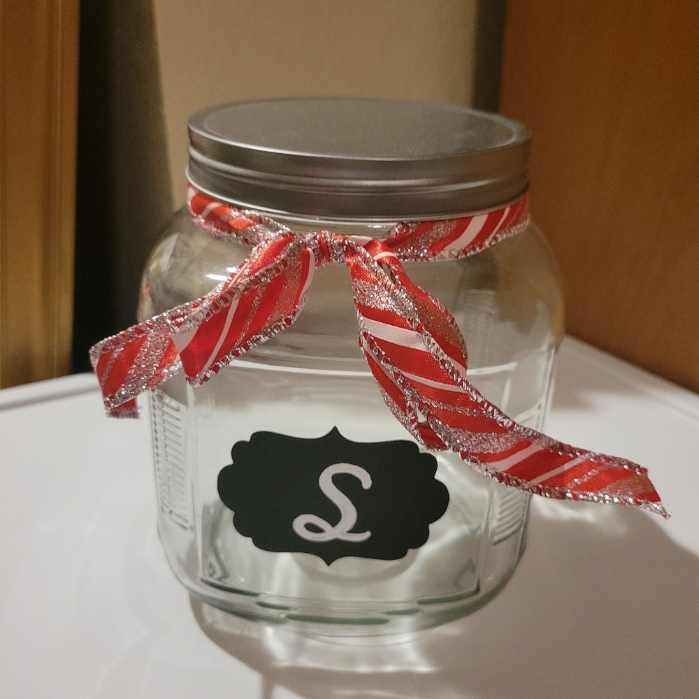 Glass jar with S